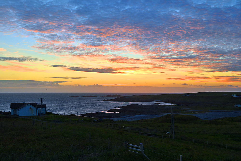 Picture of a varied coast in the summer gloaming just after sunset